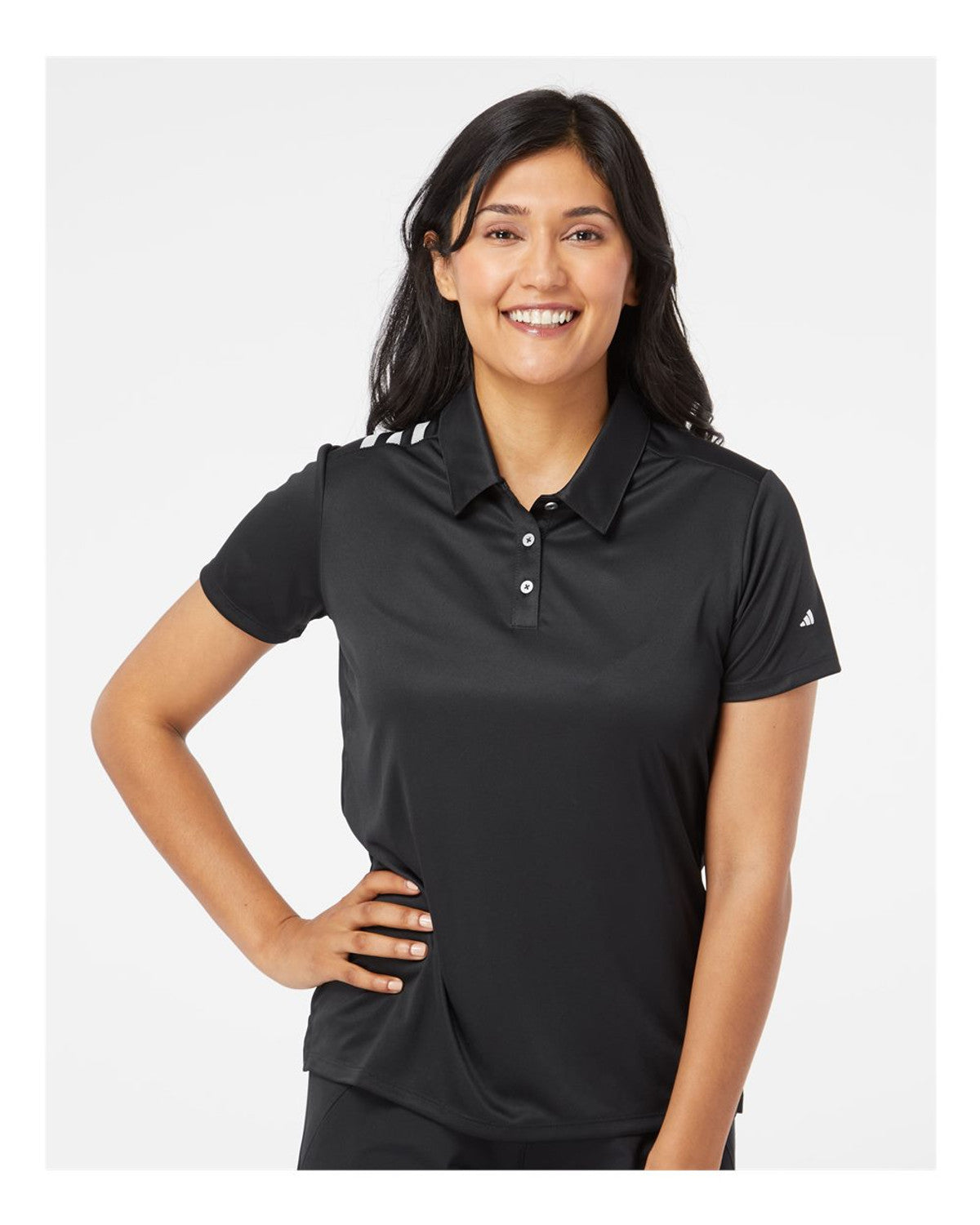 Woman wearing a black Adidas polo shirt for custom embroidery on a white background
