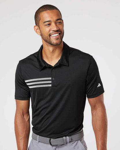 Man wearing a black Adidas polo shirt with white stripes for custom embroidery on a light gray background